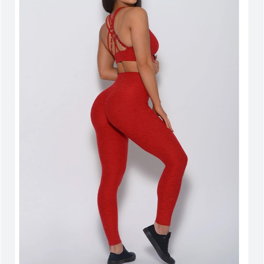 Bombshell sportswear red. Worn once.  Bra, large leggings with pockets large.